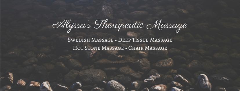 A serene arrangement of smooth, dark stones with a massage chair in the background, evoking a sense of relaxation and tranquility in Uvalde County, Texas