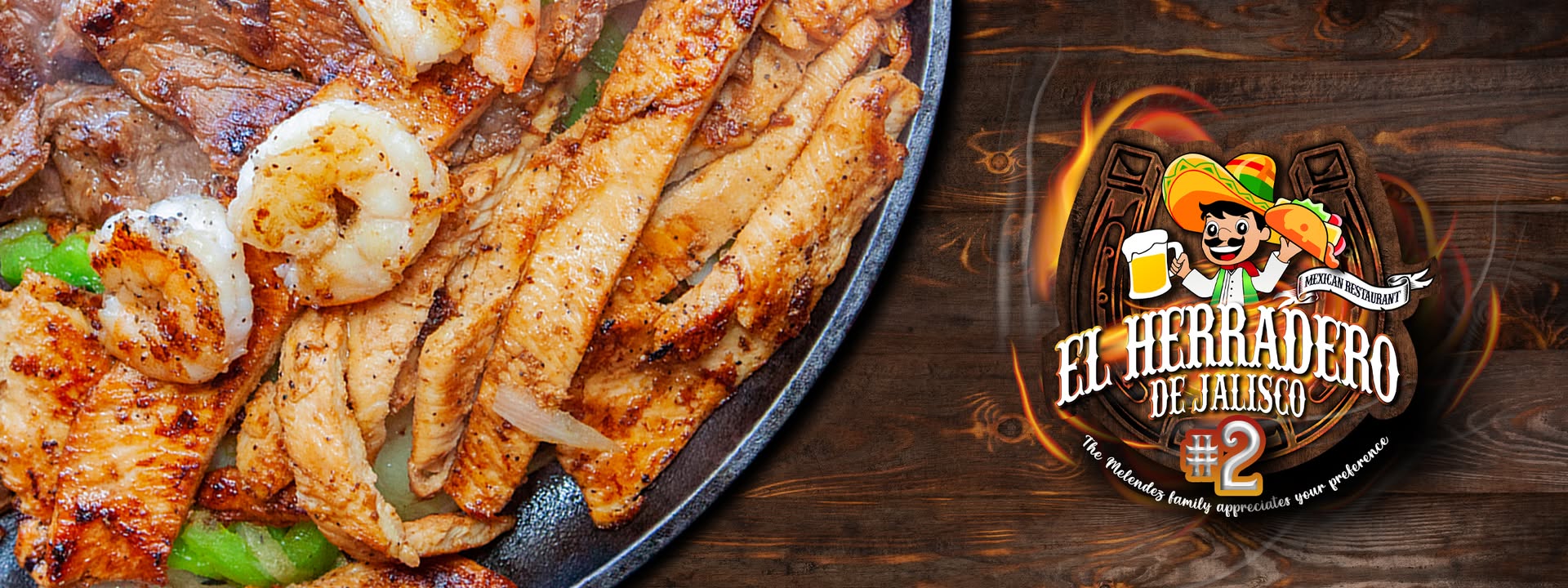 A sizzling skillet filled with grilled steak, shrimp, and chicken fajitas, garnished with peppers and onions, alongside a logo for 'El Herradero' restaurant in Uvalde County, Texas