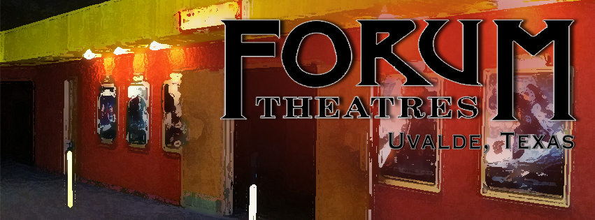 A vibrant movie theater lobby with illuminated signage and posters, located in Uvalde, Texas in Uvalde County, Texas