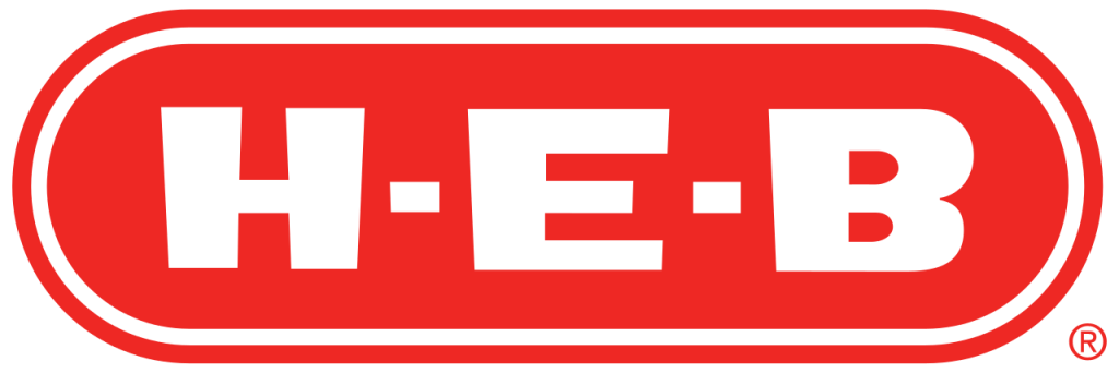 The bright orange logo of H-E-B, a popular supermarket chain in Texas, features bold white lettering within an oval shape in Uvalde County, Texas