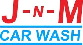 A vibrant logo for J-N-M Car Wash, featuring bold red and blue colors with a clean, modern design in Uvalde County, Texas