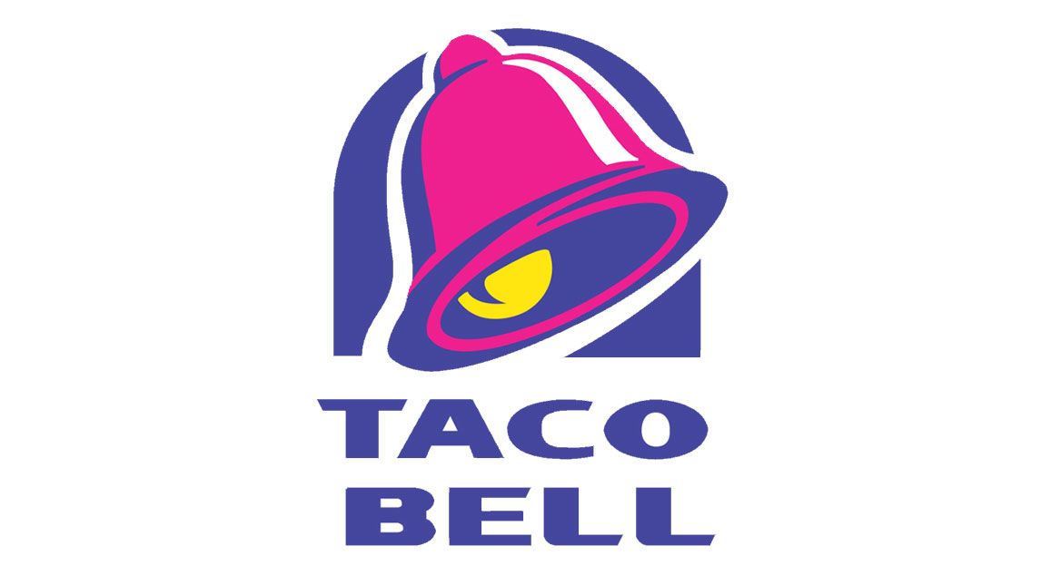 The iconic Taco Bell logo featuring a stylized pink and yellow bell inside a blue arch in Uvalde County, Texas