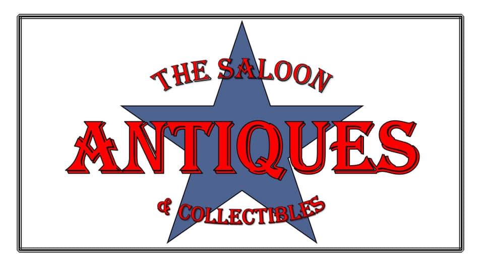 A vintage-style sign featuring a blue star with 'The Saloon Antiques & Collectibles' written in red and white text in Uvalde County, Texas