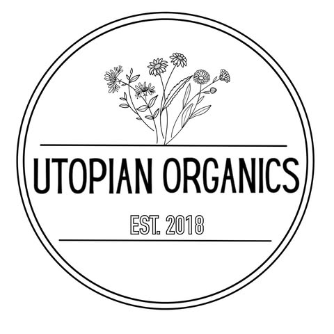 A minimalist logo featuring a circular design with a floral illustration and the text 'Utopian Organics' and 'EST. 2018' in Uvalde County, Texas